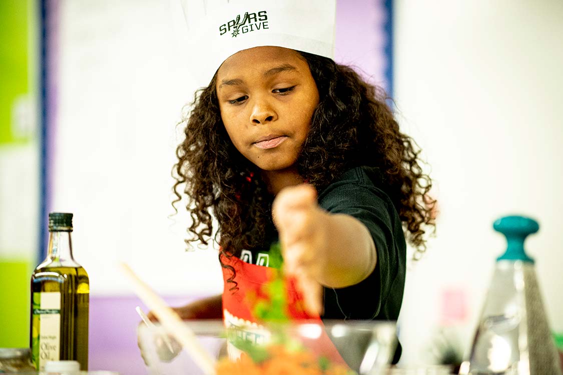 Young girl cooking